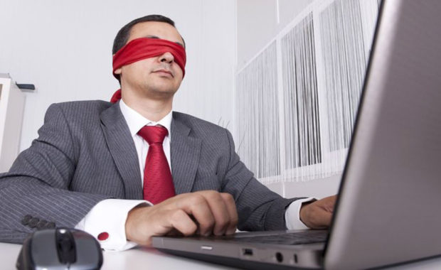 a man with a blindfold symbolizing the need for websites to use ADA compliance