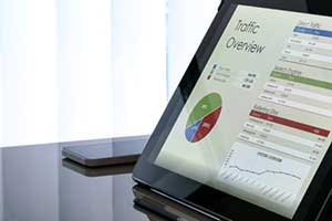 Google Analytics native advertising results on tablet showing digital marketing trends data