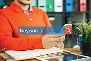 Digital marketer at seo company performing keyword research for content marketing strategy