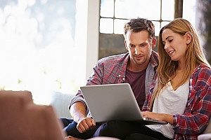 a man and woman using the NAP of a health insurance agency to get in touch with them after discovering them with the help of an insurance marketing agency