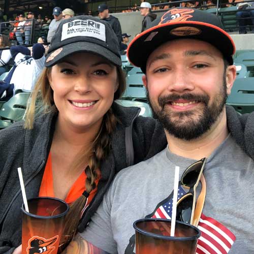 Elijah and his wife at an Orioles game
