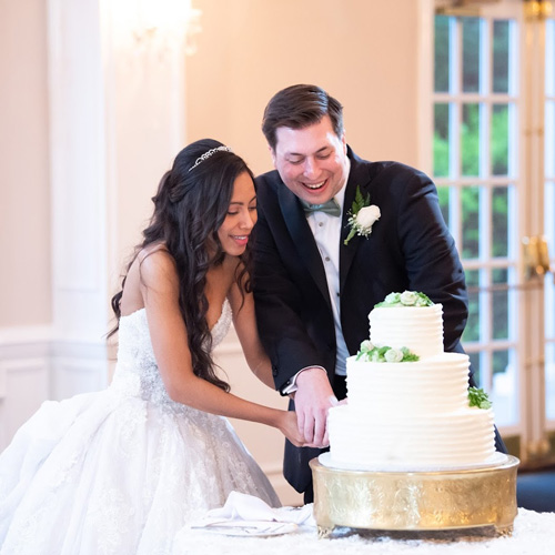 Jonathan cutting wedding cake