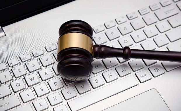 a gavel resting on top of a computer representing content marketing for law firms