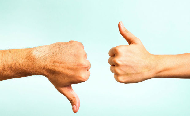 thumbs up and down representing the do's and don'ts of social media for dentists