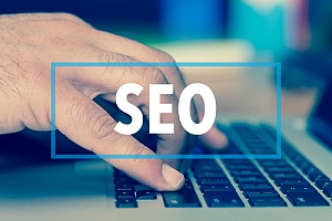 hand searching top 5 benefits of seo services for small businesses