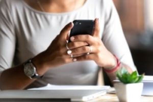 woman using her phone to research a local service