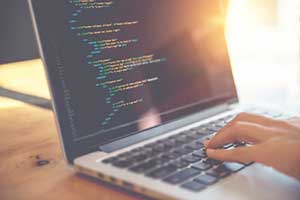 woman coding based on best seo practices
