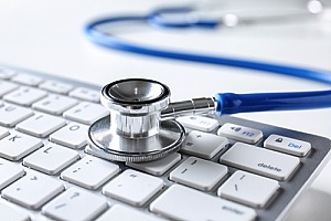 a stethoscope on a keyboard representing hospice marketing and content creation