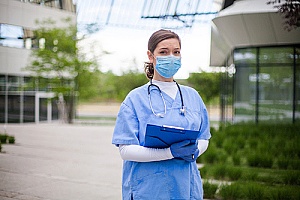 a healthcare employee who is working outside during a pandemic