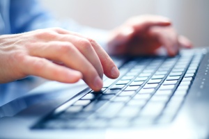 man on computer working on SEO marketing