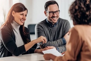 people discussing insurance policy with agent