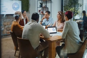 diverse team of professional businesspeople have meeting in the modern office conference room to go over their fractional marketing reports