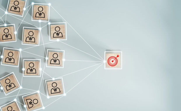 red dartboard and black arrow connection linkage with human icon for customer focus target group and customer relation management concept