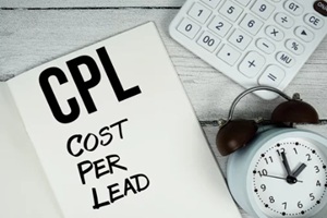 cost per lead text on paper notebook page with alarm clock and calculator on wooden background